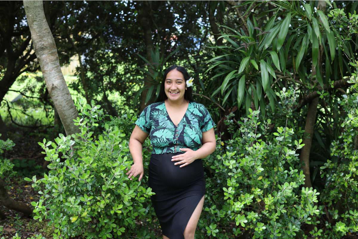 Pregnant pacific mum in tropical garden 