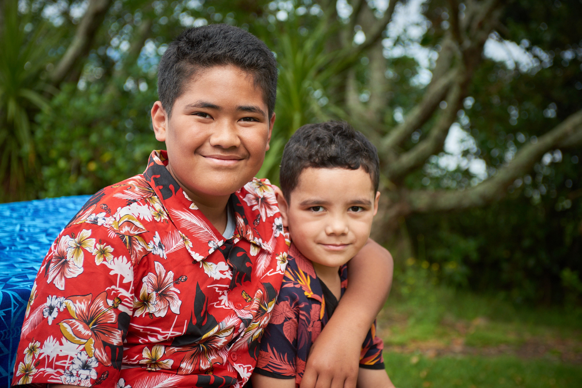 Two young Pacific boys in park